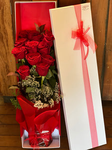 Presentation box of red roses